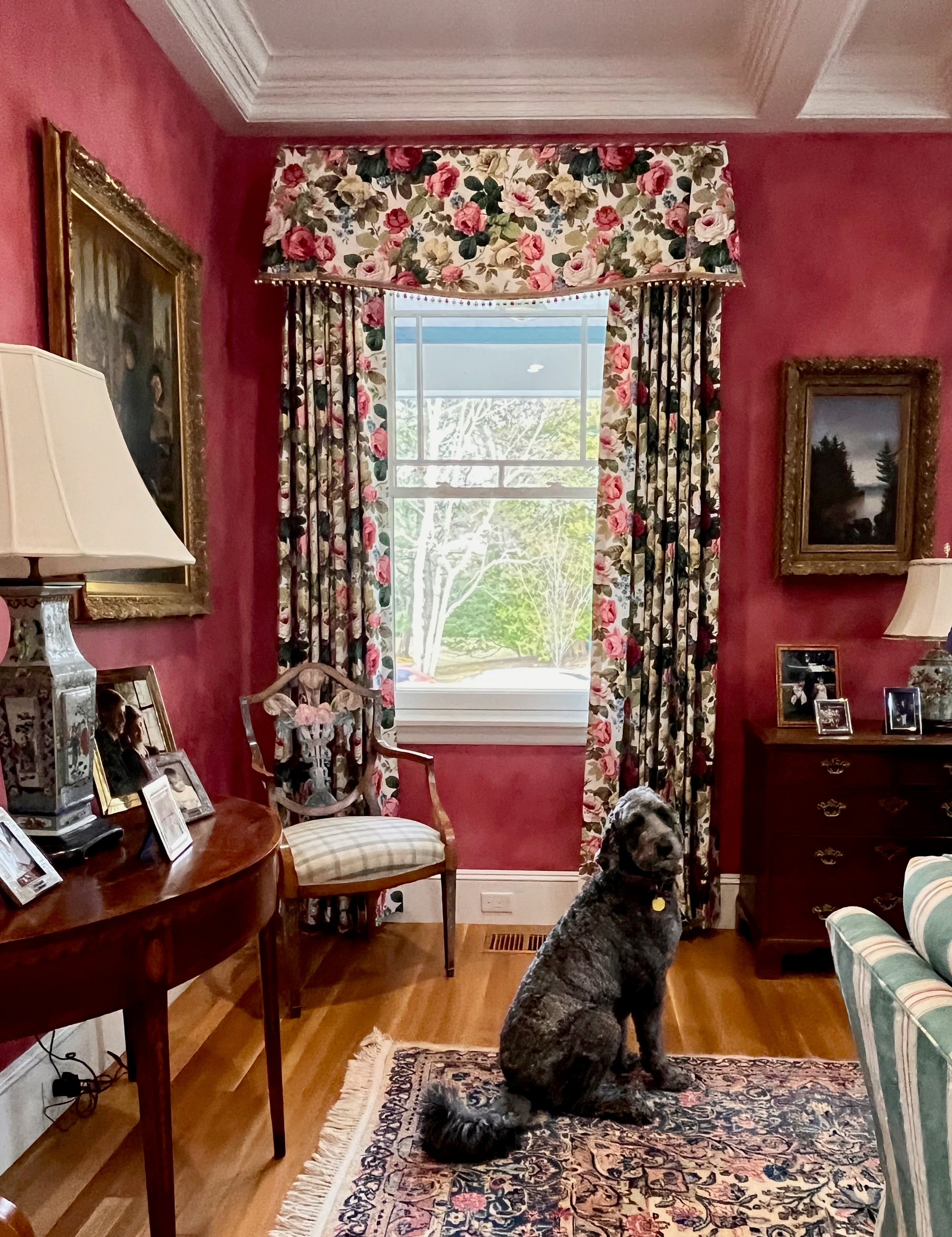 Traditional floral drapes with swag valance in red room