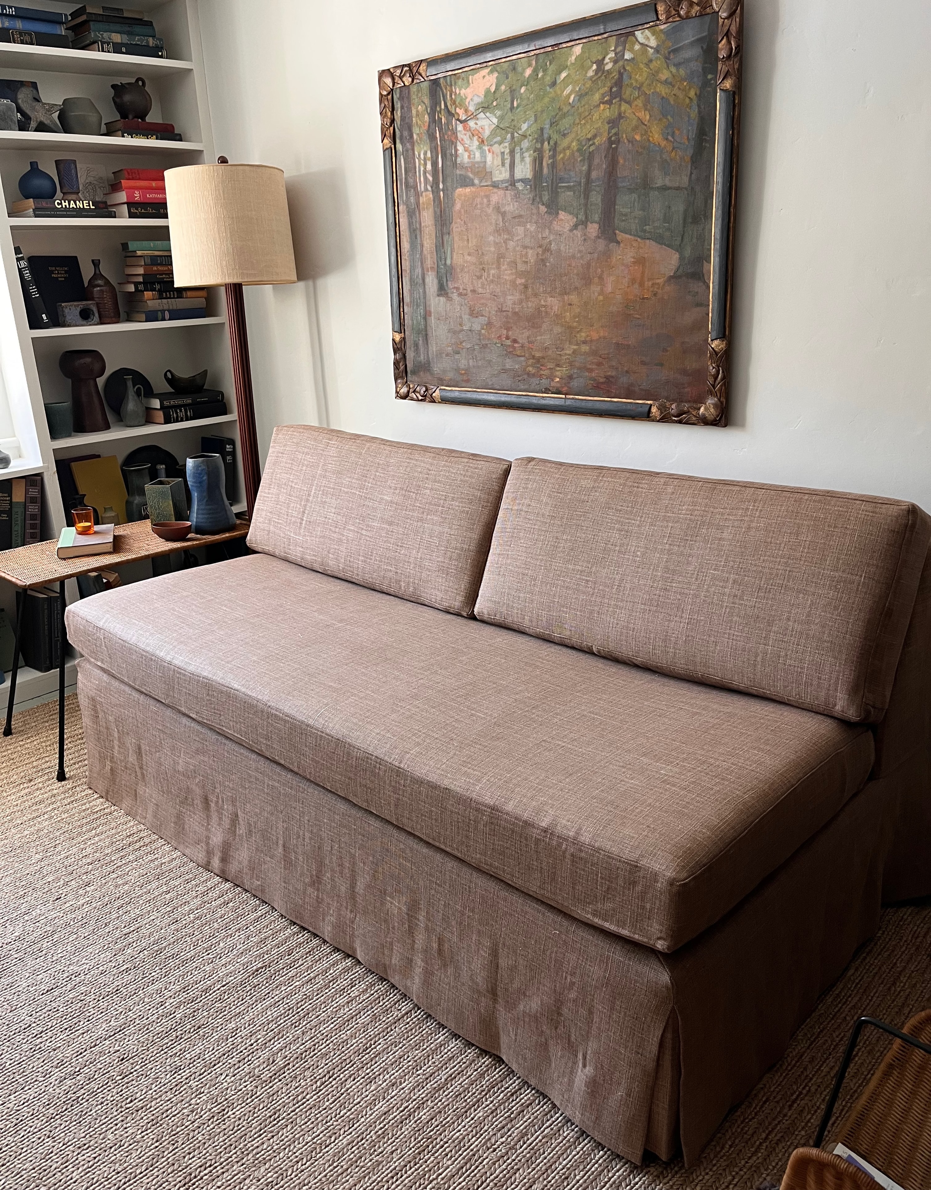 Modern living room with beige slipcovered sofa