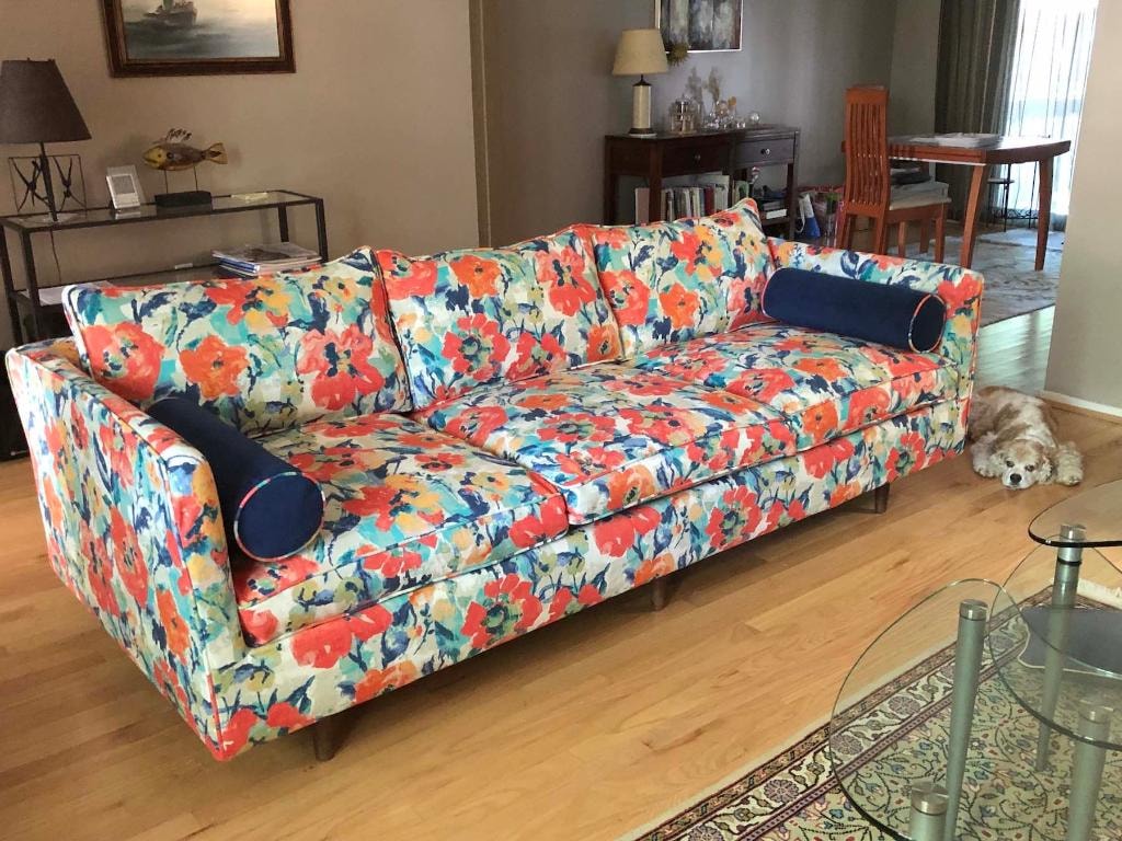 Bold floral sofa slipcover in living room