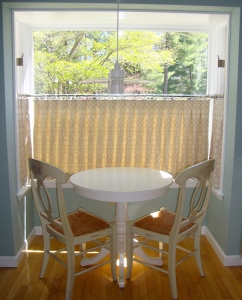 Cafe drapes in cream with table and chairs
